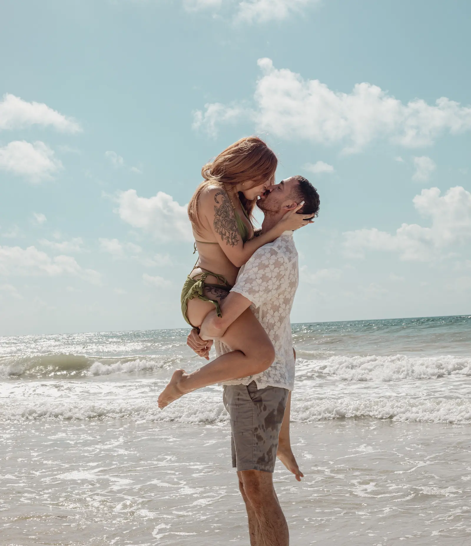 Tulum couples photographer capturing romantic beach photoshoot for engaged couple in Tulum Mexico