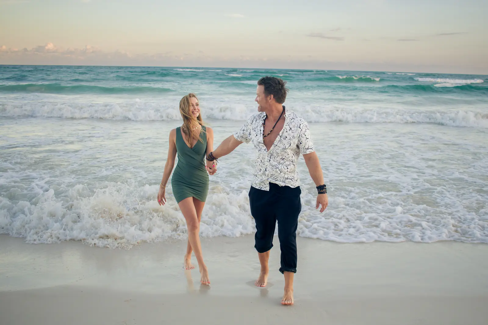 Romantic couple photo experience on Tulum beach at golden hour