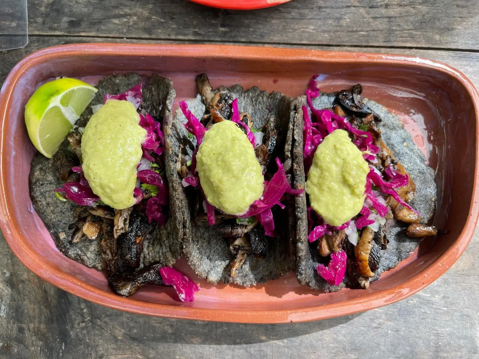 Tacos served in Tulum with lime and salsa